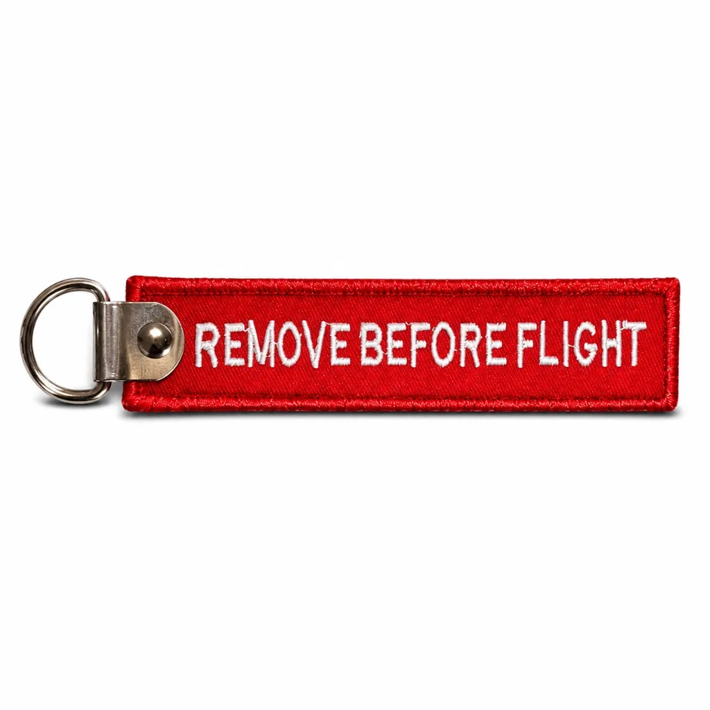 Llavero REMOVE BEFORE FLIGHT - Rojo con Broche Metálico